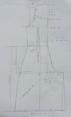 a drawing of a dress on top of a piece of paper with measurements for it