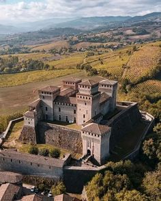 an aerial view of a castle in the countryside