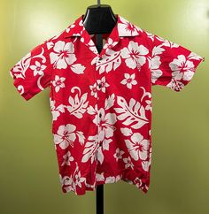 "Vintage 1970's Alohawears Boys Hawaiian Shirt. Red in color, with white flowers. Button front, coconut buttons. Size 12. Measures 36\" chest and 22.5\" length. Excellent vintage condition." Cheap Red T-shirt For Beach, Cheap Traditional Summer Shirt, Cheap Patterned Hawaiian Shirt With Floral Print, Cheap Red Hawaiian Shirt For Men, Cheap Short Sleeve Hawaiian Shirt With Hibiscus Print, Cheap Hawaiian Short Sleeve Shirt With Floral Print, Cheap Women's Hawaiian Shirt, Casual Cheap Hawaiian Shirt For Holiday, Cheap Red Hawaiian Shirt For Beach