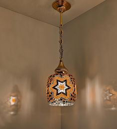 a lamp hanging from the ceiling in a room