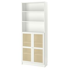 a white bookcase with wicker doors on the front and bottom shelves, against a white background