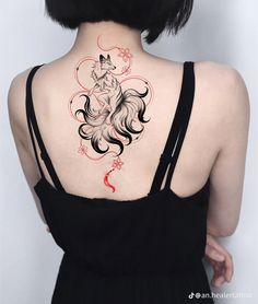 a woman with a tattoo on her back