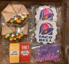 decorated cookies in a box with happy birthday messages on the front and back side, including one for taco bell