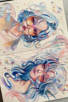 two drawings of mermaids with blue hair and bubbles on the bottom, one has her eyes closed