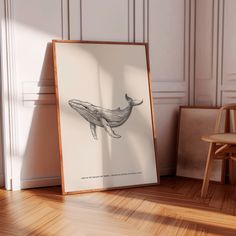 a drawing of a humpback whale is shown in front of a wooden chair