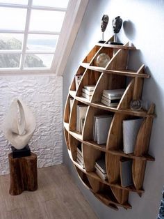 a wooden shelf with books on it and a white hat sitting on top of it