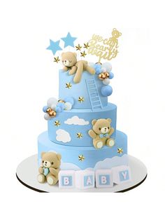 a baby shower cake with teddy bears and stars on the top, sitting on a plate