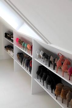 there are many pairs of shoes on the shelves