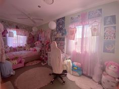 a bedroom with pink walls and lots of stuffed animals