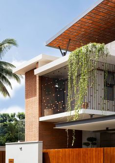 an apartment building with plants growing on it's balconies and balcony railings