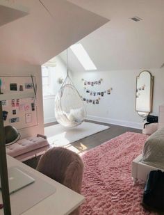 a bedroom with pink carpet and hanging chair