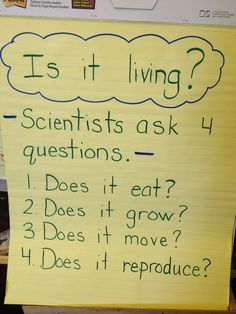 a yellow sign with writing on it that says is it living? scientist's ask 4 questions does it eat? 2 does it grow 3 does it move