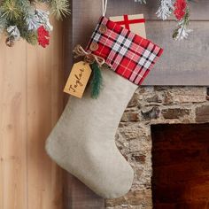 a christmas stocking hanging from a fireplace