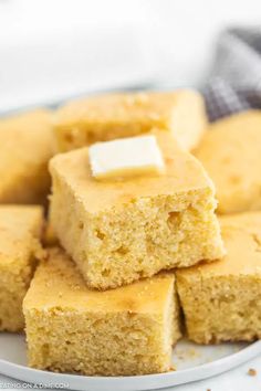 several pieces of cornbread with butter on top