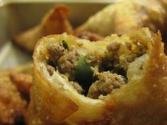 some food is sitting in a pan on the table and it looks like they are stuffed with meat