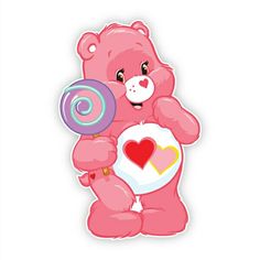 a pink teddy bear holding a heart shaped lollipop