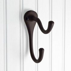 an umbrella shaped hook on the side of a door