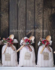 three small bags with wooden spoons in them