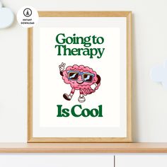 a poster with the words going to therapy is cool in front of a white wall