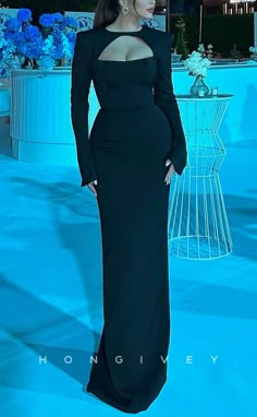 The L2190 floor-length evening dress is perfect for a special event. Crafted from luxurious satin fabric, this dress shows off sophisticated fitted scoop empire design with long sleeves. The empire-inspired silhouette adds elegance and sophistication. Long Dresses Elegant Glamour, Long Sleeve Black Dinner Dress, Black Women In Long Dresses, Sophisticated Black Dress, Black Dress Looks Classy, Elegant Floor Length Dress, Evening Dinner Gown, How To Style Long Black Dress, Long Sleeve Dinner Dress