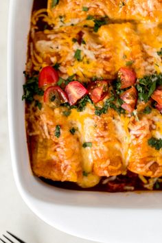 a casserole dish with meat, cheese and vegetables