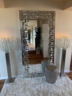 a large mirror sitting on top of a white rug