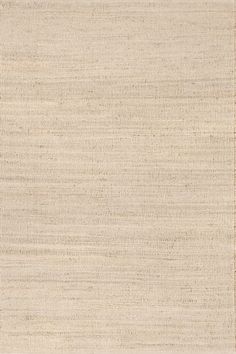 an area rug that has been made with natural fibers and is very soft, light beige