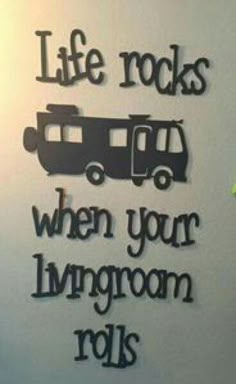 there is a sign that says life rocks when your living room rolls on the wall