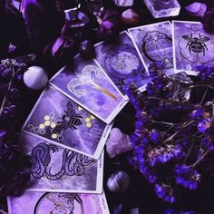 purple cards and flowers on the ground