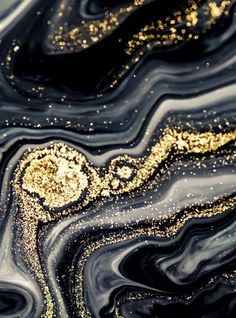 an abstract black and gold painting with lots of glitter