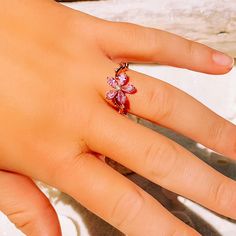 This gorgeous dainty sparkling pink topaz flower ring is perfect for everyday wear or for a special occasion. Makes the perfect gift for any occasion. * 18K Rose Gold Filled * Flower size is approximately 1x1cm * Simulated Topaz * Nickle and Lead Free *Size 6 and 7 only * Photos enlarged to show detail * Ring box included *For returns/refunds please contact me within 3 days, please ship items back in original condition within 7 days of receipt. Delicate Pink Flower Ring For Gift, Delicate Pink Flower Ring As Gift, Delicate Pink Flower Ring Gift, Adjustable Pink Rings For Proposal, Rose Gold Flower Ring For Gift, Adjustable Crystal Flower Ring, Pink Flower Promise Ring, Rose Gold Flower Proposal Ring, Adjustable Flower Crystal Ring