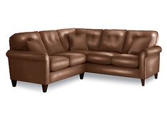 a brown leather sectional sofa on a white background