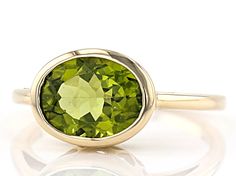 2.44ct Oval Manchurian Peridot(TM) Solitaire, 10k Yellow Gold Ring. Measures Approximately .46"L x .36"W. Classic Gold Ring With Peridot, Yellow Gold Peridot Round Rings, Yellow Gold Solitaire Peridot Rings, Yellow Peridot Round Ring, Yellow Gold Peridot Rings With Gemstone Accents, Fig Wedding, Peridot Engagement Rings, Mothers Ring, Peridot Jewelry