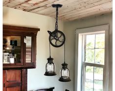 three hanging lights in the corner of a room