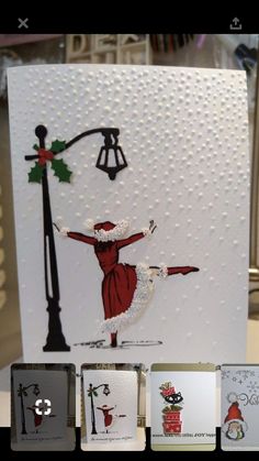 a card with an image of a woman holding a lamp post and christmas decorations on it