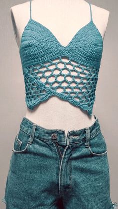 a mannequin wearing shorts and a top with crochet on the bottom