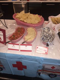 a table topped with lots of food and condiments