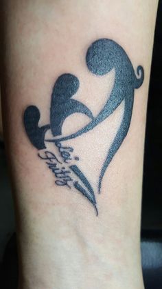 a tattoo on the foot of a person with a knife in it's hand