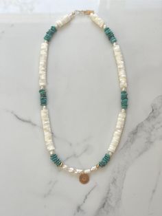 Beautiful 17 inches long mother Pearl Heishi beads and turquoise Heishi beads with white pearls, goldfilled beads and round 12mm handstamped sun pendant in 14kt goldfilled. Turquoise Beads Necklace, Heishi Bead Necklace, Handmade White Pearl Necklace In 14k Gold-filled, Bohemian 14k Gold-filled Beaded Necklaces, Bohemian 14k Gold-filled Gemstone Bead Necklaces, Bohemian 14k Gold-filled Necklaces With Gemstone Beads, Bohemian 14k Gold-filled Gemstone Beads Necklace, Turquoise Bohemian Beaded Necklaces With Pearl Charm, Large Bead Necklace