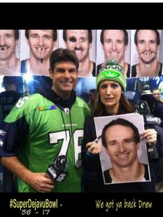 two people standing next to each other in front of a wall with pictures of football players