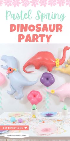 the dinosaur party is set up with balloons and donuts