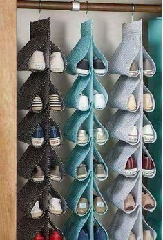 a bunch of shoes are hanging up on the wall