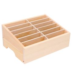 a wooden box that has compartments in it