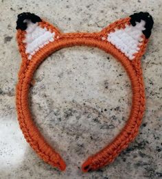 Crocheted Fox Headband Skinny Fox Ears make everyone's day better. - Hand-crocheted  - Narrow Width that stays put - Black, white, and orange yarn - Ears curl over naturally  - Soft yarn cushions between the head and headband - Felt cushions the ends of the headband and coordinates with the fox colors What does the fox say? If you like this item, take a look at: Unicorn Headband https://www.etsy.com/listing/606966858/unicorn-headband-crochet-sparkle-magical?ref=shop_home_active_8&frs=1 Tiger Headband https://www.etsy.com/listing/564752535/tiger-ears-headband-auburn-orange?ref=shop_home_active_13&frs=1 Free Shipping with orders over $35  Thanks for shopping at A Dash of Excitement! www.etsy.com/shop/adashofexcitement Headphones Diy, Fox Colors, Crocheted Fox, Fox Headband, What Does The Fox Say, Felt Cushion, Headband Crochet, Fox Ears, Unicorn Headband