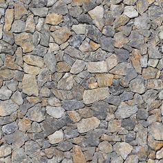 a stone wall that looks like it has been made out of various types of rocks