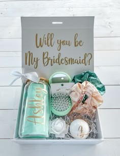 a bridesmaid gift box filled with personalized items and the words will you be my bridesmaid?