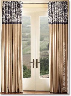 an open door with curtains hanging on it's side and the view out to fields