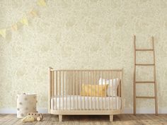 a baby's room with a wooden crib and yellow pillows