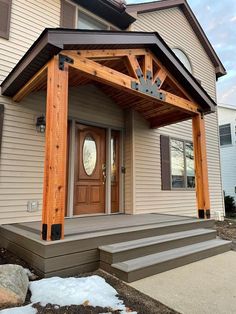 a house with a wooden porch and front door