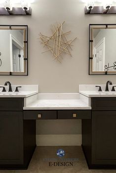 a bathroom with two sinks and mirrors on the wall